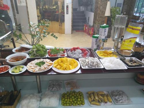 a buffet with many plates of food on a table at DREAM HOTEL Bắc Ninh in Hòa Ðình