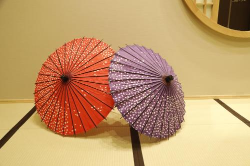 different colored umbrellas on a table at Onyado Nono Asakusa Natural Hot Spring in Tokyo