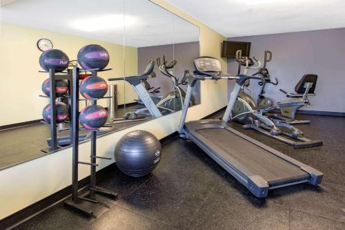 a gym with several exercise bikes and a mirror at Days Inn by Wyndham Grantville in Grantville