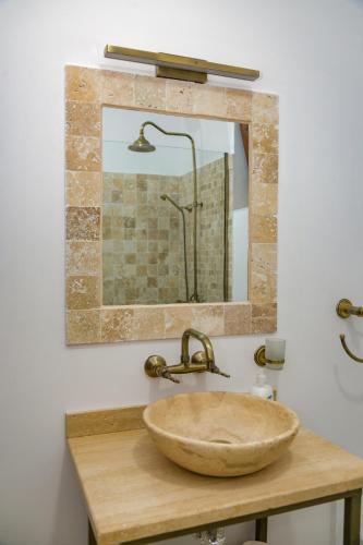 a bathroom with a sink and a mirror at Summer Villa in Vama Veche