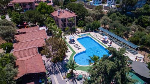 an overhead view of a swimming pool in a resort at Club Pink Palace Hotel in Oludeniz