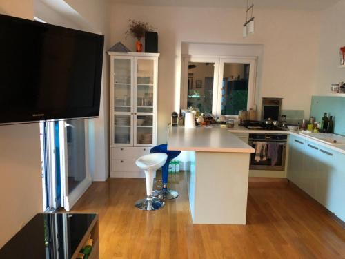 a kitchen with white cabinets and a counter top at Apartment Nicole in Novalja
