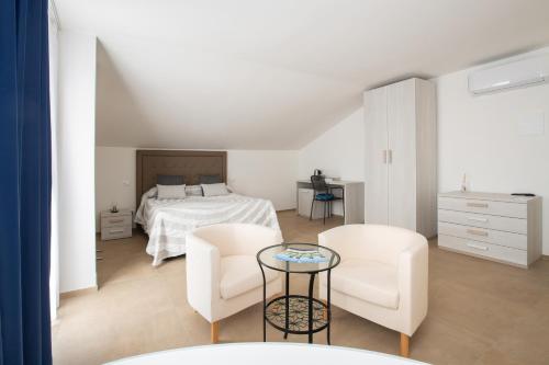 Postel nebo postele na pokoji v ubytování Villa Coppitella, rooms & apartments