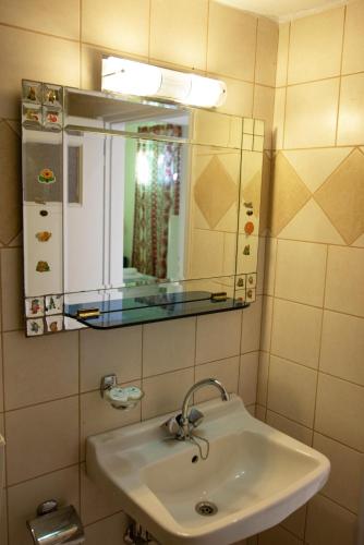 a bathroom with a sink and a mirror at Elysium in Glinádhon