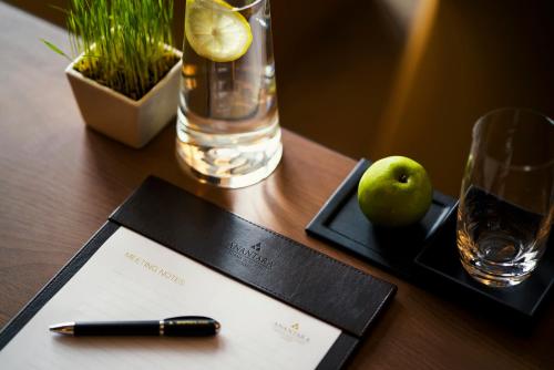 a pen and a piece of paper on a table at Anantara Lawana Koh Samui Resort in Chaweng