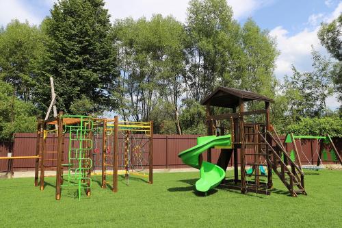 a group of playground equipment in a park at Apple House in Mykulychyn