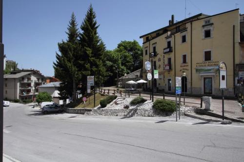 an empty street in a town with a building at Residenza dei Maestri in Roccaraso