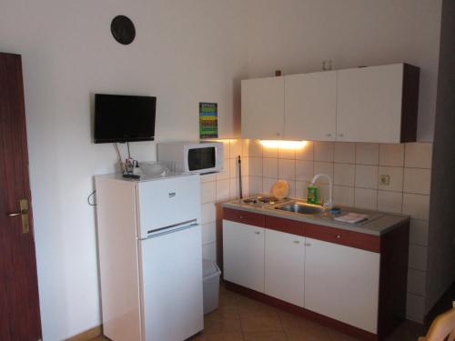 Kuchyňa alebo kuchynka v ubytovaní Apartment Krizanovic