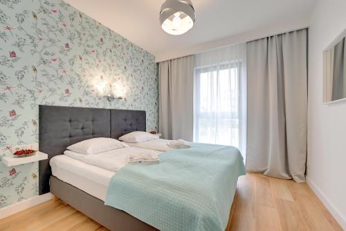 Posteľ alebo postele v izbe v ubytovaní Wave Apartments - Nadmorze
