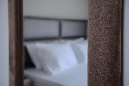 Ένα ή περισσότερα κρεβάτια σε δωμάτιο στο L - Suites