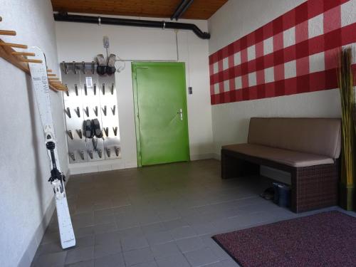 a room with a bench and a green door at Haus Kaunergrat in Kaunertal