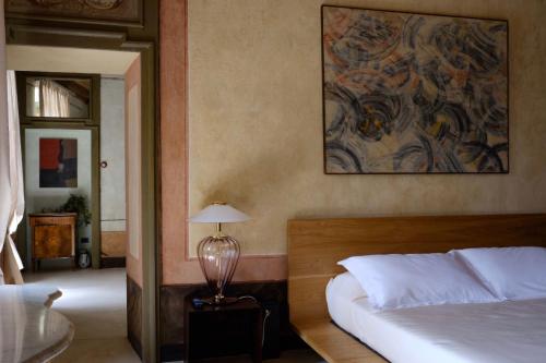 Letto o letti in una camera di Antica Dimora Gallo Basteris