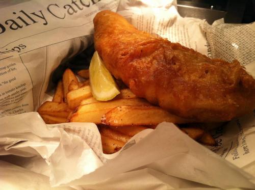 a basket of food with fish and french fries at Kings Head Hotel in North Elmham