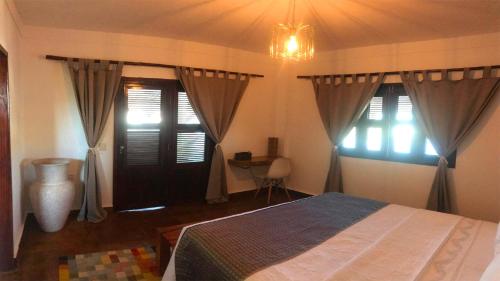 Una cama o camas en una habitación de R.I.O