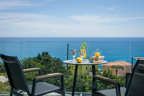 a table and chairs with a view of the ocean at Villa Blue Sea in Skala