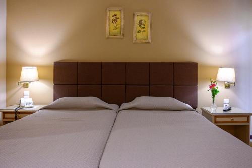 Postel nebo postele na pokoji v ubytování Hotel Vyzantino
