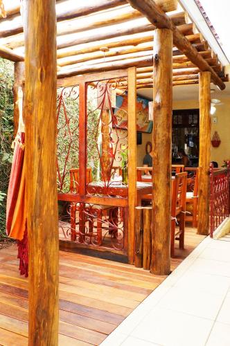 a restaurant with a large glass door with a table at Pousada Baobá e SPA in Olinda