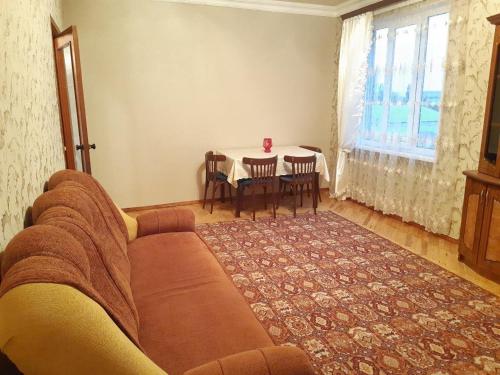a living room with a couch and a table at SPARTA Apartment Complex in Sevan