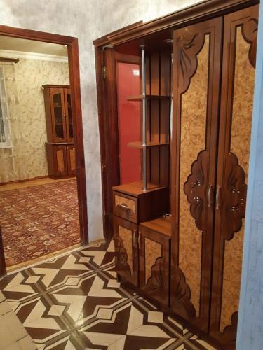a room with a wooden cabinet and a door at SPARTA Apartment Complex in Sevan