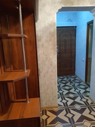 a hallway with a door and a tile floor at SPARTA Apartment Complex in Sevan