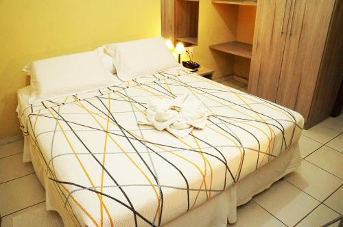 Cama ou camas em um quarto em Pousada Baobá