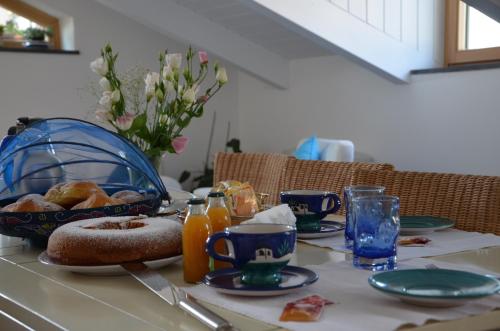 a table with a plate of breakfast food on it at La Soffitta Sul Mare in Vietri sul Mare