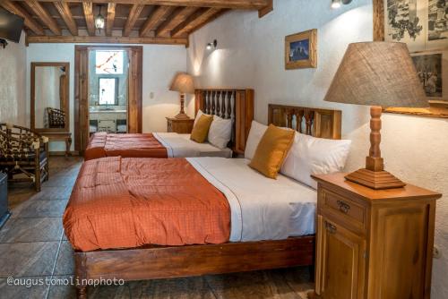 Katil atau katil-katil dalam bilik di Hotel El Cristo