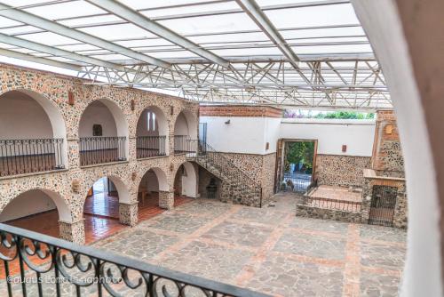 a view of therium of a building with a balcony at Hotel El Cristo in Cholula