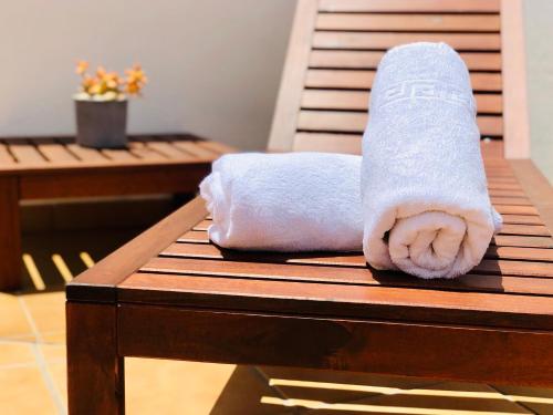 a towel sitting on top of a wooden table at Canaryislandshost l Lovely Lanzarote in Nazaret