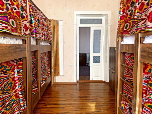 a room filled with lots of different types of ties at Hostel Imona in Samarkand