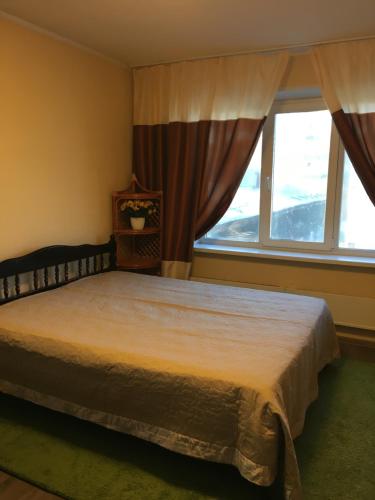 Кровать или кровати в номере Apartments at Pavlova 21