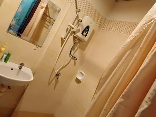 Et badeværelse på Homestay Pagar Buruk Bukit Merah L2 - AIR CONDITIONED