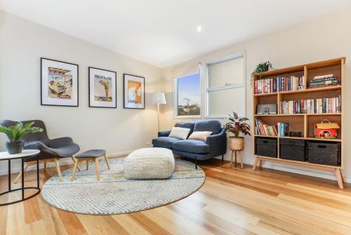 a living room with a couch and a chair at Seascape - The Ultimate Inverloch Retreat in Inverloch