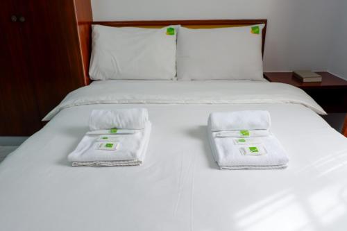 Säng eller sängar i ett rum på Albergo Hotel