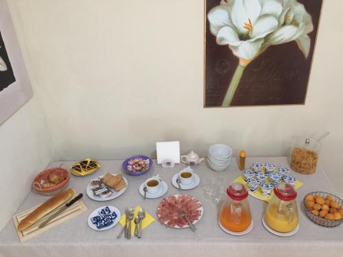 a table with a bunch of plates and food on it at Agriturismo Il Casolare in Poppi
