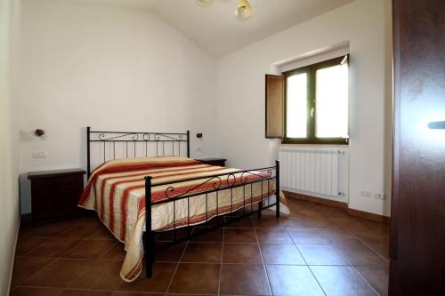 Llit o llits en una habitació de La Mansarda in Pineta