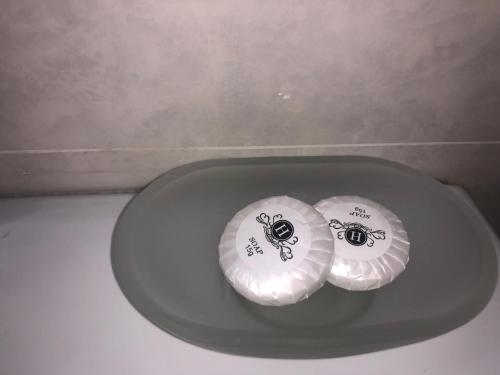 two paper plates sitting on top of a plate at my house in Tbilisi City