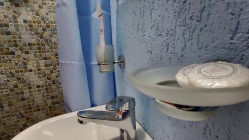a bathroom with a sink and a toilet at ICity Hills in Kutaisi