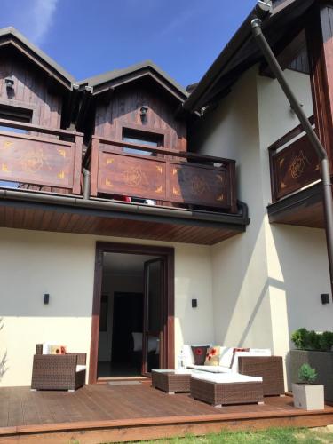 a house with two balconies on top of it at Pieninski Mak. in Szczawnica