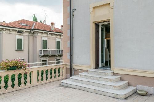 a balcony of a building with stairs and a window at Juliet House in Verona