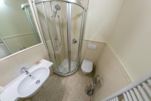 a bathroom with a sink and a shower at Juliet House in Verona
