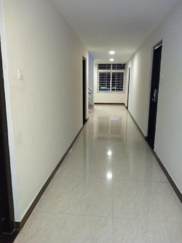 an empty hallway with white walls and white floors at saravanaa residency in Madurai