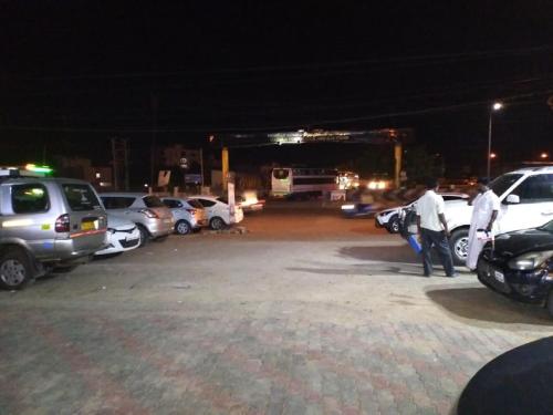 a group of cars parked in a parking lot at night at saravanaa residency in Madurai