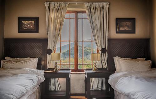 Ένα ή περισσότερα κρεβάτια σε δωμάτιο στο Rooiberg Lodge