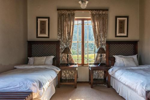 Ένα ή περισσότερα κρεβάτια σε δωμάτιο στο Rooiberg Lodge