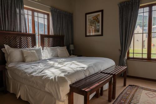 Ένα ή περισσότερα κρεβάτια σε δωμάτιο στο Rooiberg Lodge