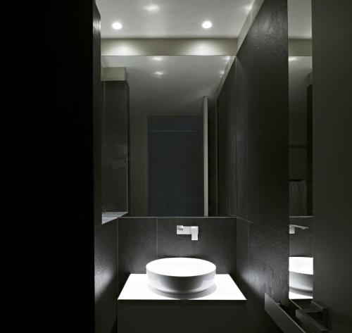 a bathroom with a white sink and a mirror at Hotel Villa Belvedere in Taormina