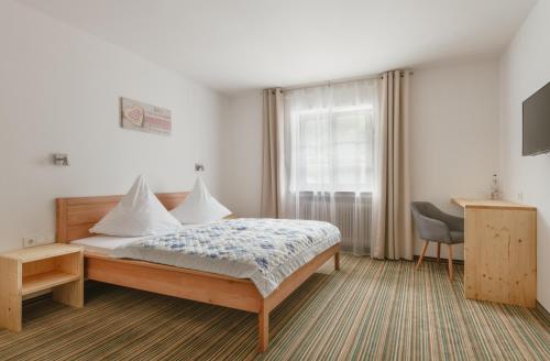 Postel nebo postele na pokoji v ubytování Gasthof Höhenrain