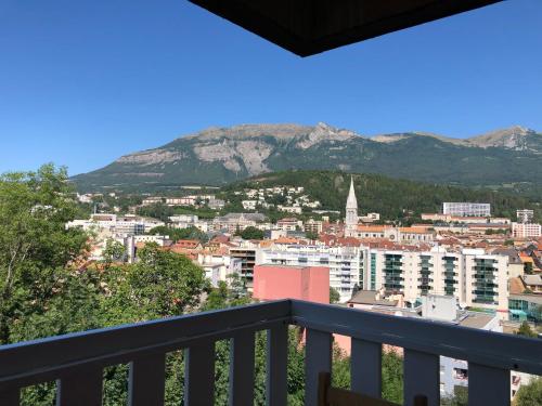 a view of a city from a balcony at Appartement de charme idéalement situé in Gap