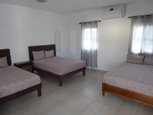 Postel nebo postele na pokoji v ubytování Hostal Casa Clavel